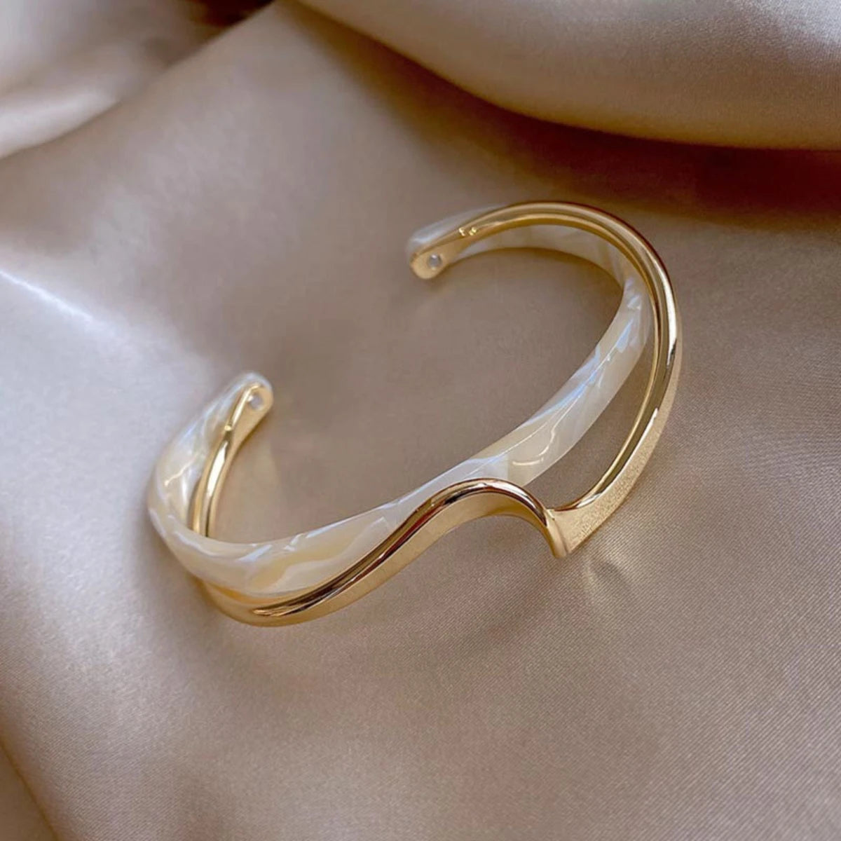 Women's Gold Bracelets Charming and sophisticated, these gold bracelets with sparkling stone accents and an elegant finish are perfect to complement any look.
