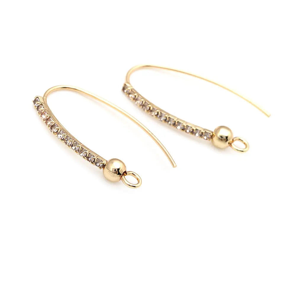 Gold Earrings with Crystals Delicate and sophisticated, these gold earrings feature a curved design with sparkling crystals, perfect for adding a touch of elegance to your look.