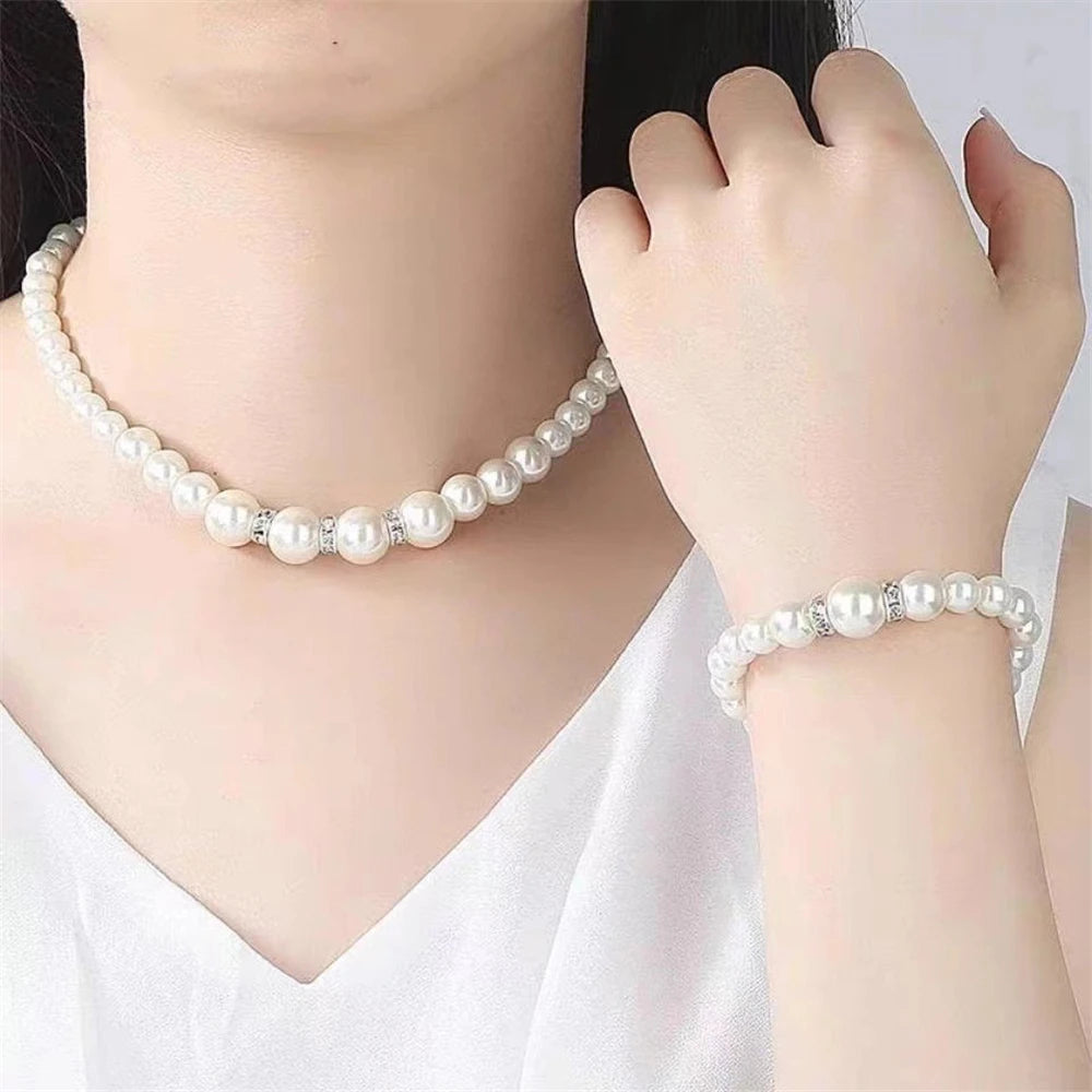 Pearl Jewelry Set Classic and elegant, this set includes a pearl necklace, bracelet, and earrings, accented with crystal details. A timeless choice for any special occasion.