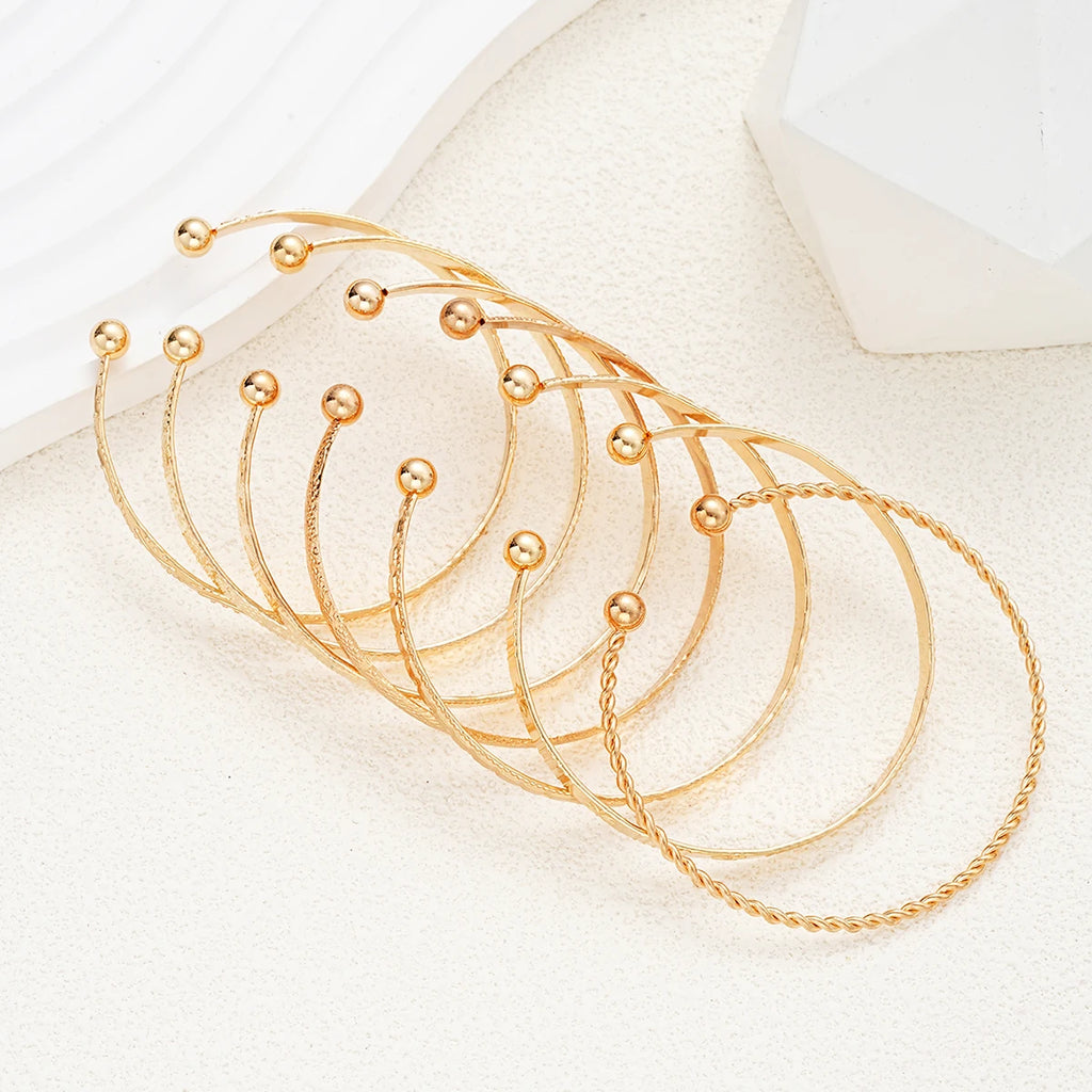 Composed of 7 gold punk bracelets for women, street fashion, gothic heart prints, metal design, open bracelet, fashion jewelry