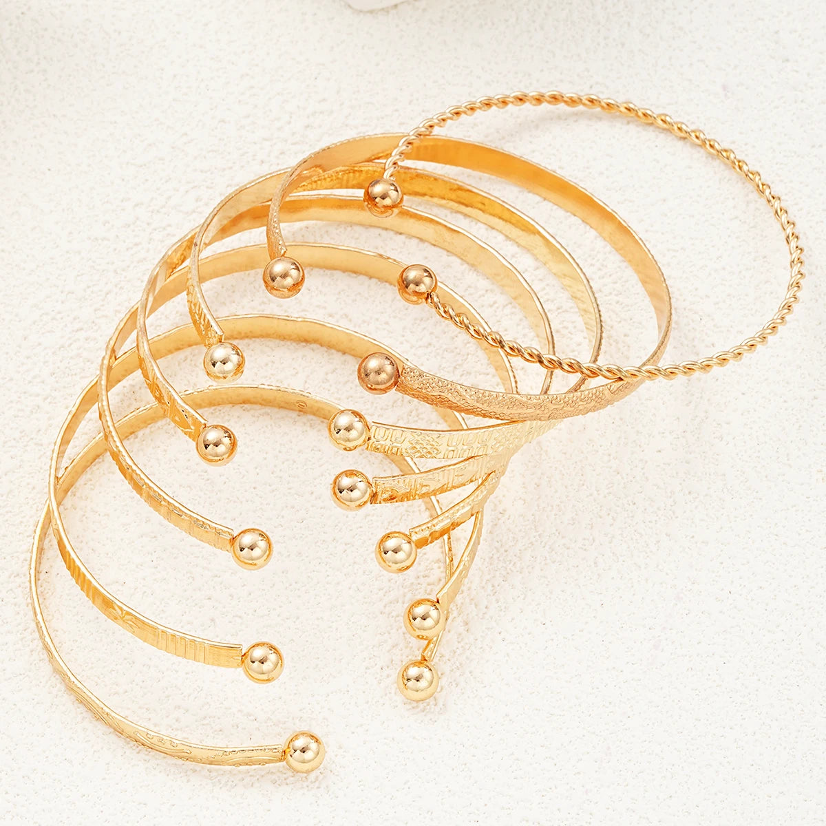 Composed of 7 gold punk bracelets for women, street fashion, gothic heart prints, metal design, open bracelet, fashion jewelry
