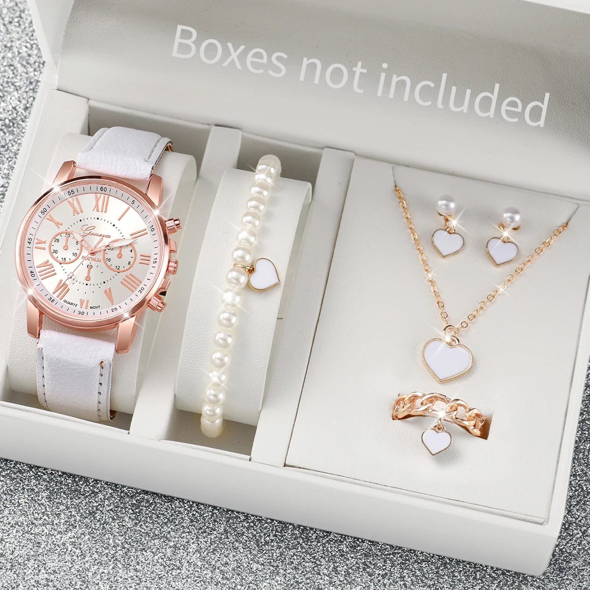 Women's Watch and Jewelry Set Elegant and delicate, this set includes a pink watch, bracelet, necklace, earrings, and ring with heart details and sparkling pink stones. Perfect for gifting or complementing your style.