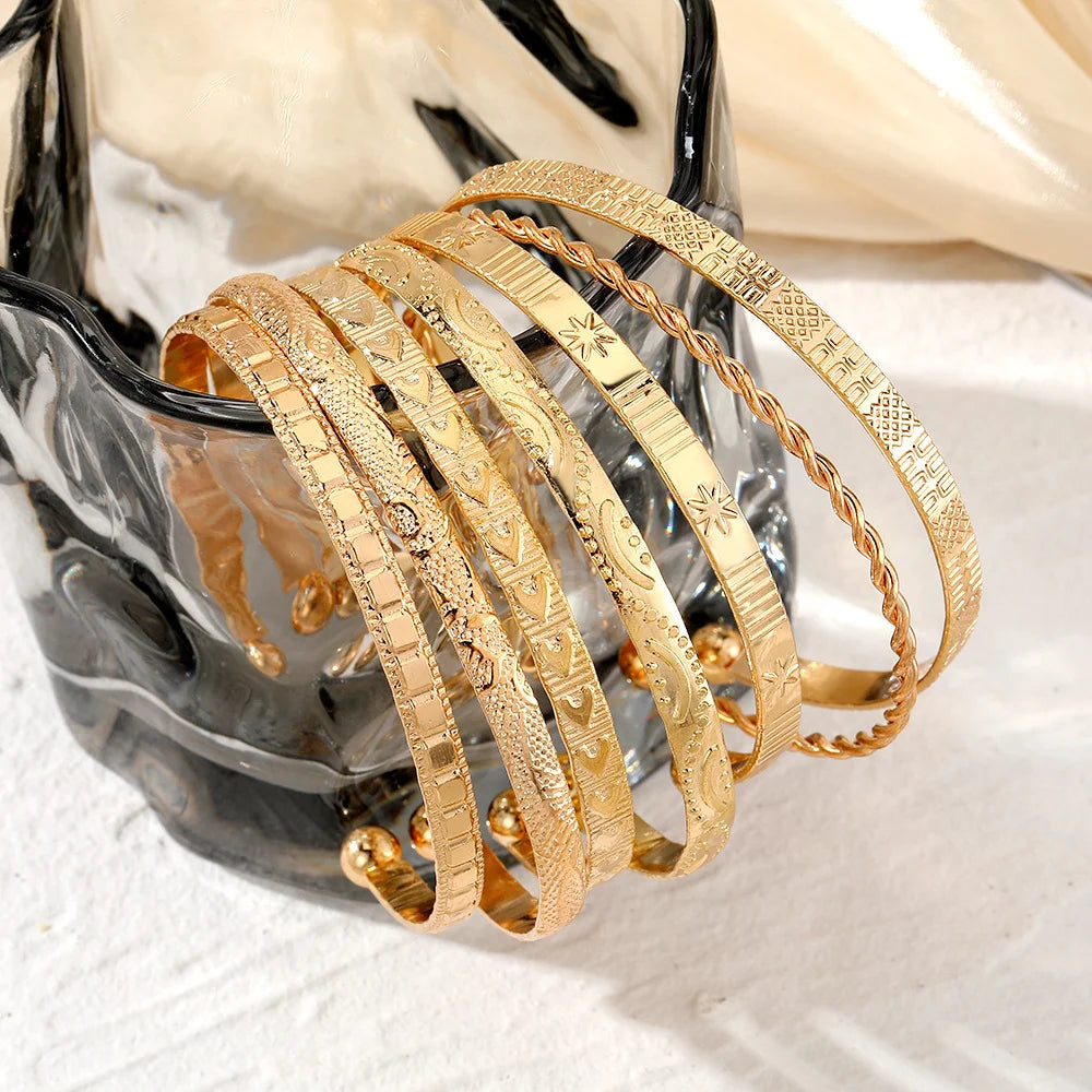 Composed of 7 gold punk bracelets for women, street fashion, gothic heart prints, metal design, open bracelet, fashion jewelry