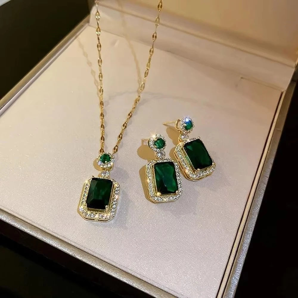 Classic set consisting of three women's jewelry pieces: jadeite ring, green zirconia ring, earrings, necklace