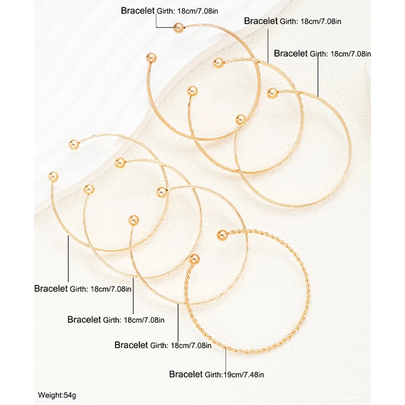 Composed of 7 gold punk bracelets for women, street fashion, gothic heart prints, metal design, open bracelet, fashion jewelry