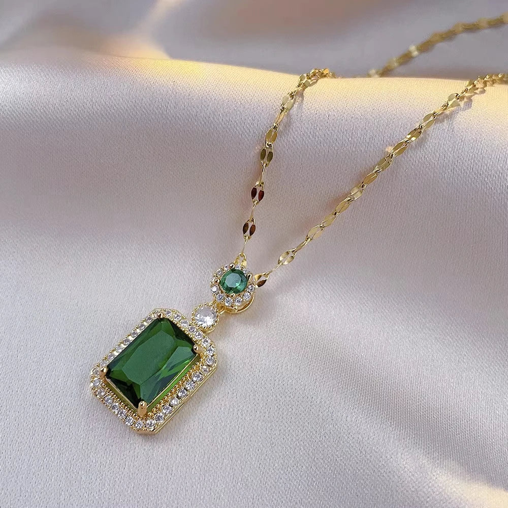Classic set consisting of three women's jewelry pieces: jadeite ring, green zirconia ring, earrings, necklace