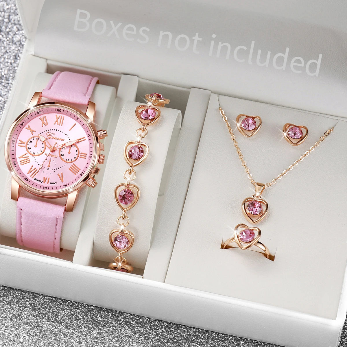Women's Watch and Jewelry Set Elegant and delicate, this set includes a pink watch, bracelet, necklace, earrings, and ring with heart details and sparkling pink stones. Perfect for gifting or complementing your style.