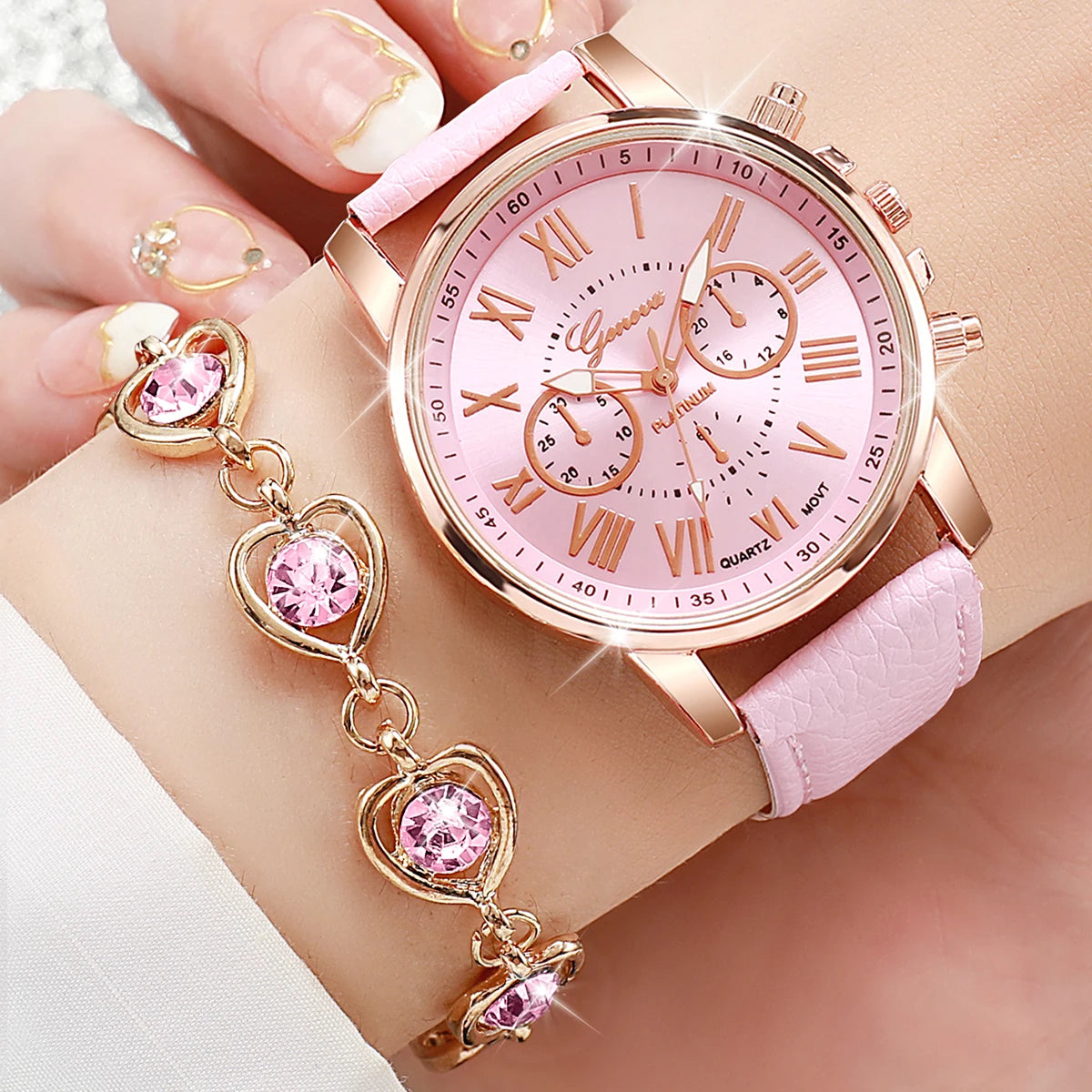 Women's Watch and Jewelry Set Elegant and delicate, this set includes a pink watch, bracelet, necklace, earrings, and ring with heart details and sparkling pink stones. Perfect for gifting or complementing your style.