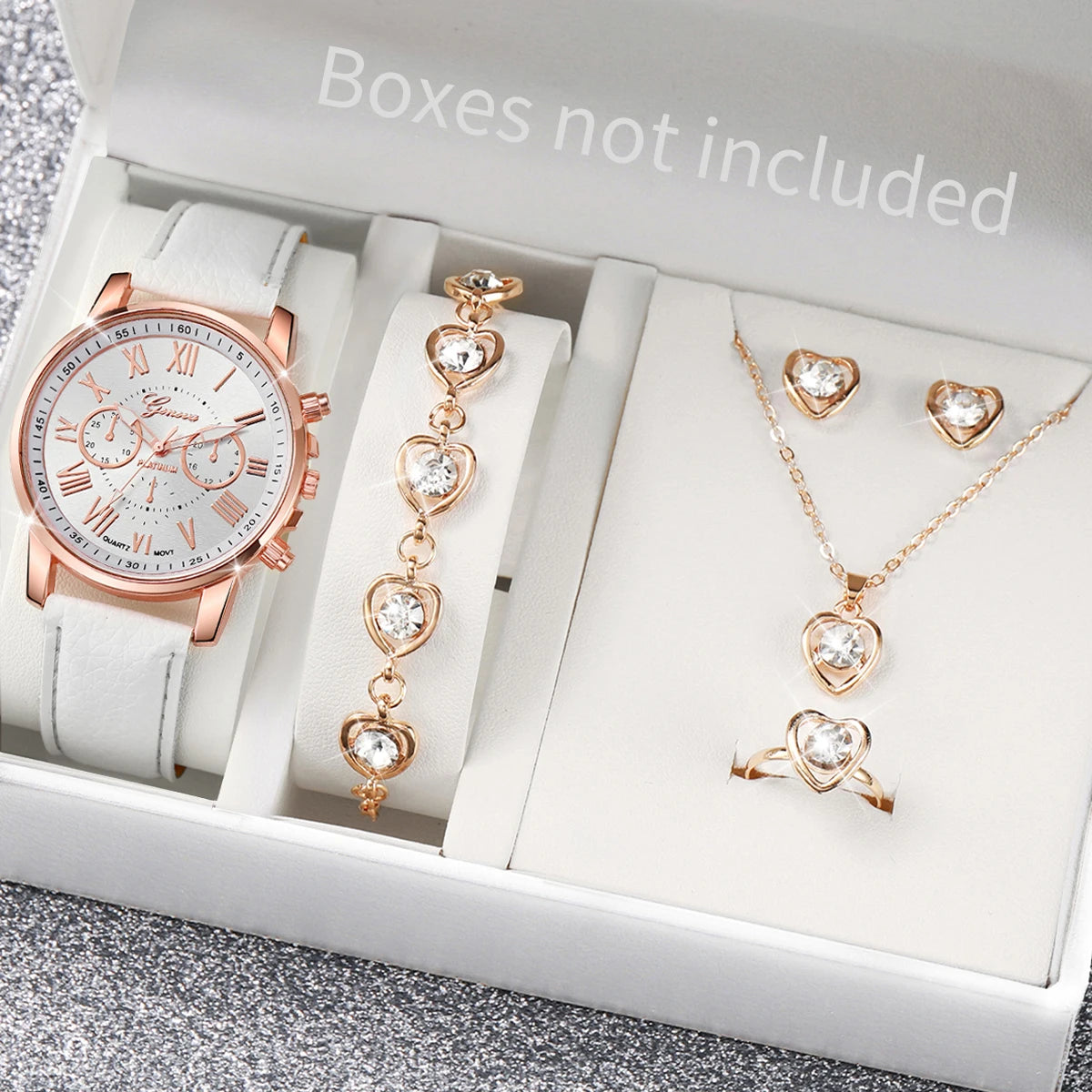 Women's Watch and Jewelry Set Elegant and delicate, this set includes a pink watch, bracelet, necklace, earrings, and ring with heart details and sparkling pink stones. Perfect for gifting or complementing your style.