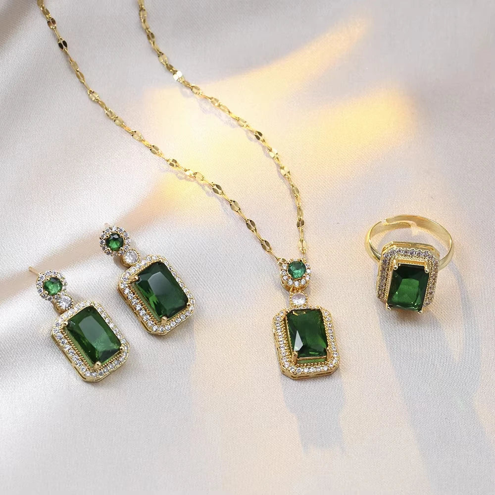 Classic set consisting of three women's jewelry pieces: jadeite ring, green zirconia ring, earrings, necklace