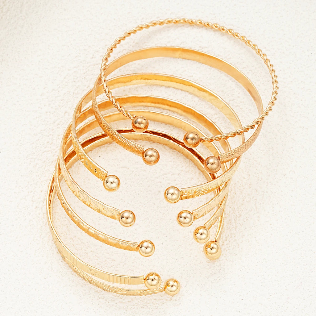 Composed of 7 gold punk bracelets for women, street fashion, gothic heart prints, metal design, open bracelet, fashion jewelry