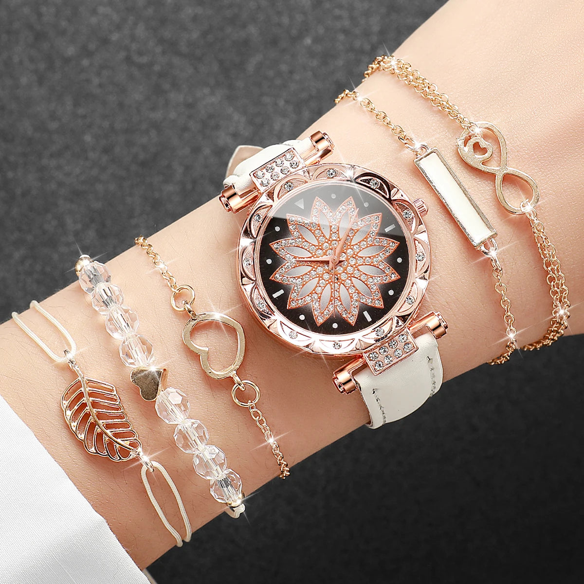 This elegant set includes a floral-designed wristwatch and delicate bracelets, all in rose gold tones. Ideal for those seeking versatility and beauty in accessories. (Boxes not included).