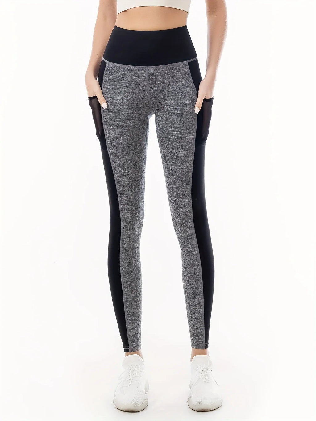 Women's Two-Tone Fitness Leggings High-waisted leggings in a two-tone design (gray and black), combining style and comfort. Perfect for workouts and casual wear, with stretchy fabric that ensures freedom of movement.