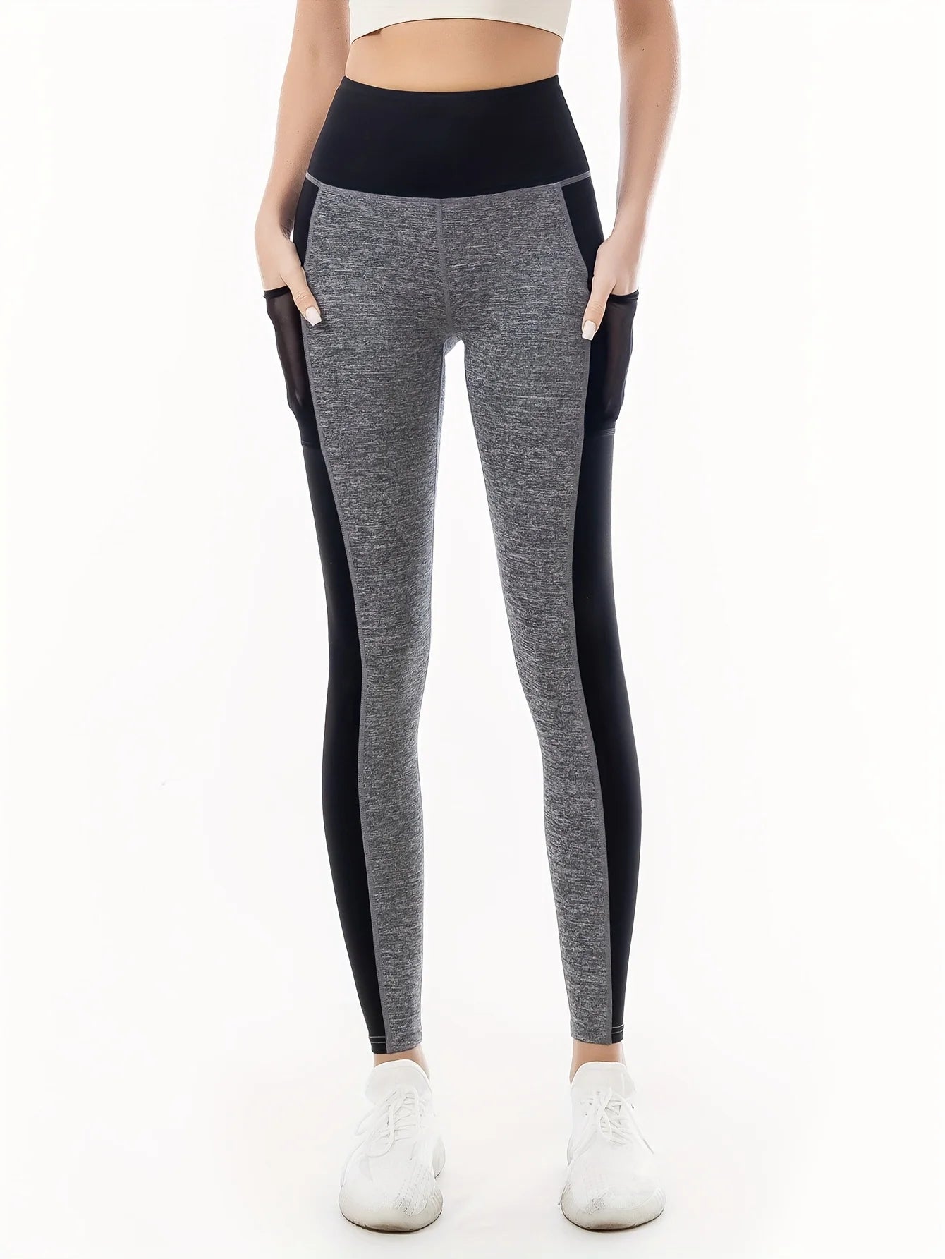 Women's Two-Tone Fitness Leggings High-waisted leggings in a two-tone design (gray and black), combining style and comfort. Perfect for workouts and casual wear, with stretchy fabric that ensures freedom of movement.