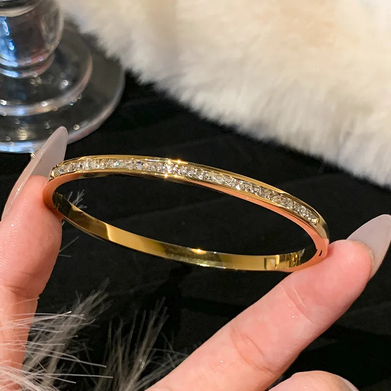 Women's Gold Bracelets Charming and sophisticated, these gold bracelets with sparkling stone accents and an elegant finish are perfect to complement any look.