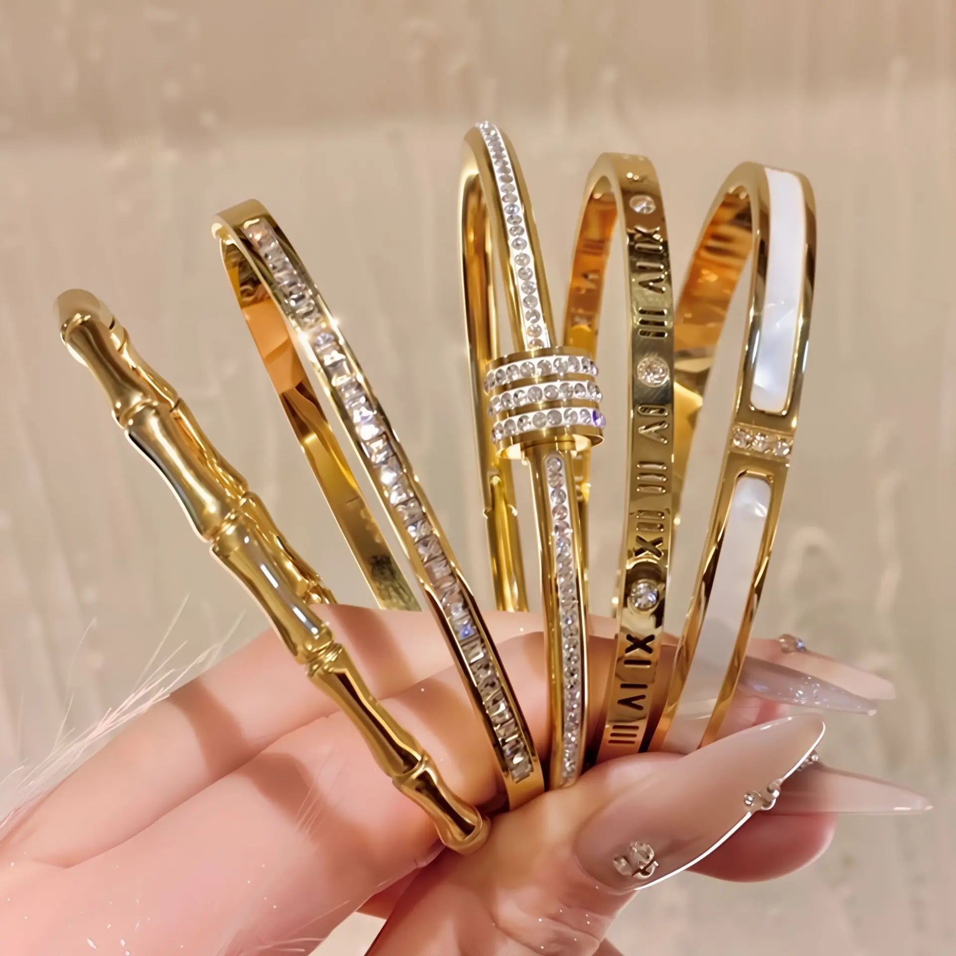 Women's Gold Bracelets Charming and sophisticated, these gold bracelets with sparkling stone accents and an elegant finish are perfect to complement any look.