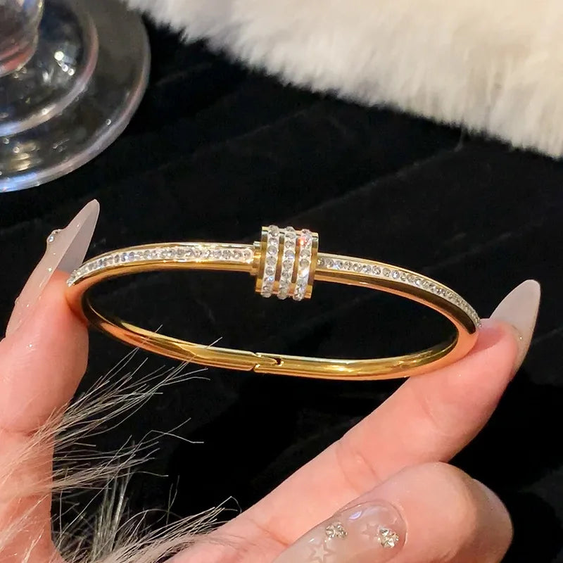 Women's Gold Bracelets Charming and sophisticated, these gold bracelets with sparkling stone accents and an elegant finish are perfect to complement any look.