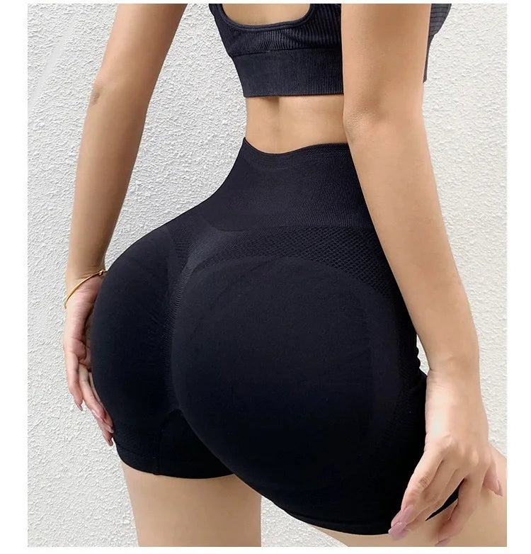 :  Women's Shapewear Fitness Shorts High-waisted, shapewear shorts that enhance curves, providing comfort and support during workouts. Available in several modern colors.